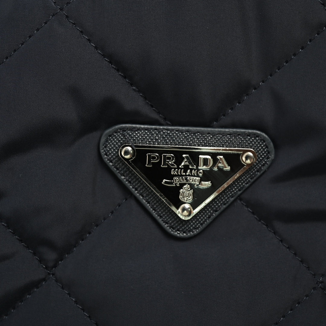 Corduroy collar triangle logo diamond quilted jacket