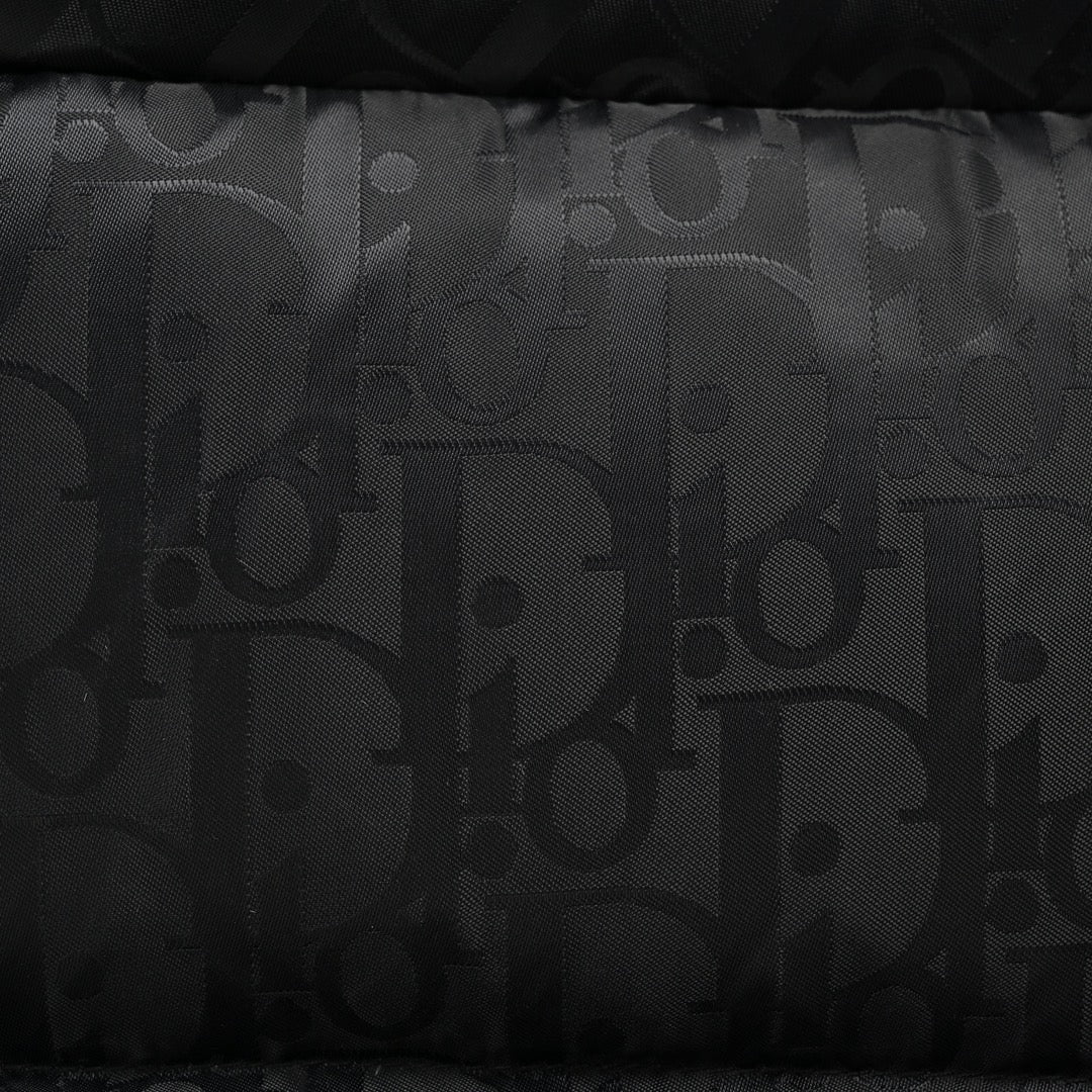 Down jacket with all-over dark pattern and monogram